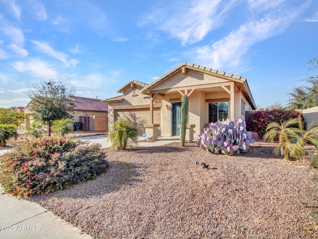 18556 W Vogel Ave, Goodyear, AZ 85338 - view of front facade with an attached garage and stucco siding