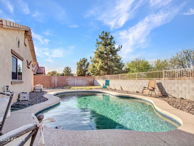 view of swimming pool featuring a fenced in pool, a patio area, and a fenced backyard