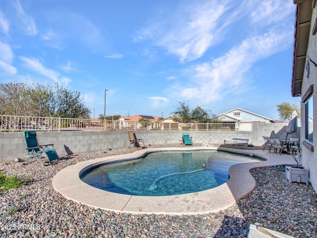 view of pool featuring a patio, a fenced backyard, and a fenced in pool