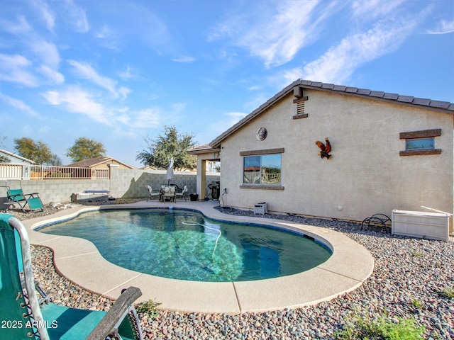 view of swimming pool with a patio area, a fenced backyard, and a fenced in pool