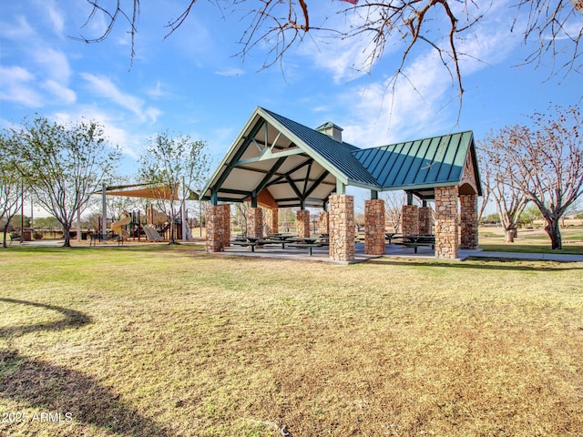 surrounding community with playground community, a lawn, and a gazebo