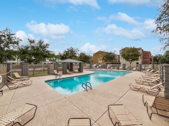 view of swimming pool with a patio