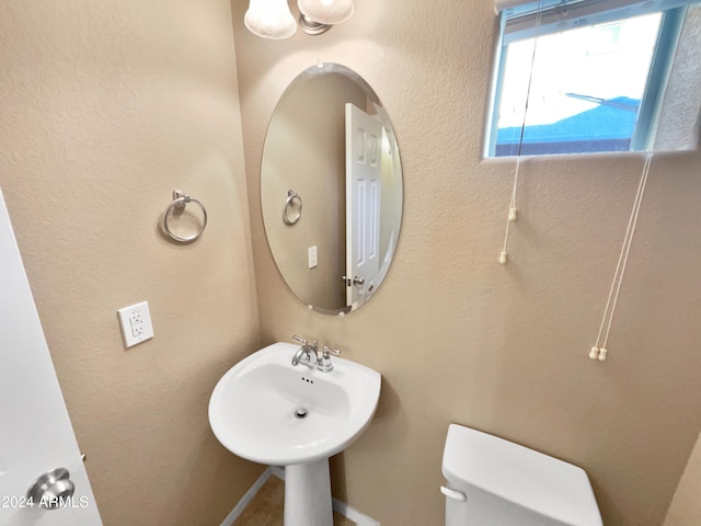 bathroom with toilet and sink