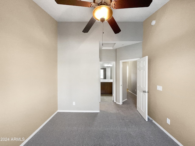 carpeted empty room with ceiling fan