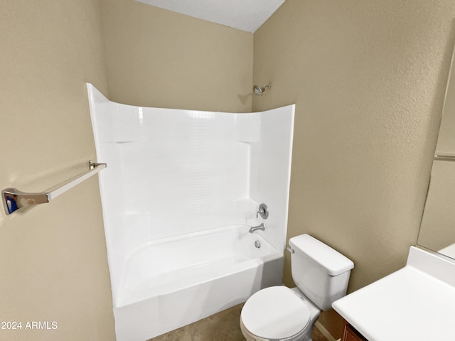 full bathroom featuring washtub / shower combination, vanity, and toilet