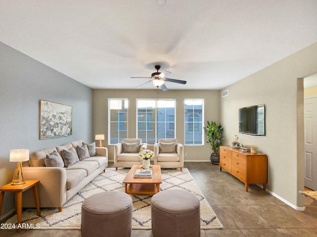 tiled living room featuring ceiling fan