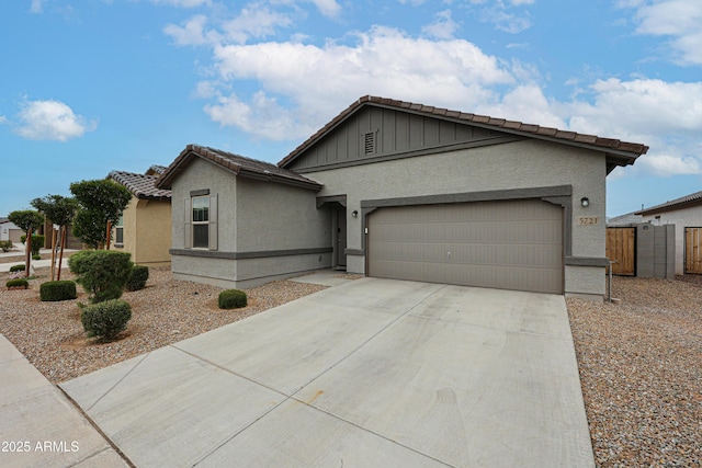 5721 W Coplen Farms Rd, Laveen, AZ 85339 - single story home with a tile roof, stucco siding, an attached garage, and driveway