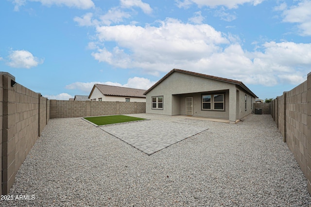 5721 W Coplen Farms Rd, Laveen, AZ 85339 - rear view of house featuring stucco siding, a fenced backyard, a patio area, and central air condition unit