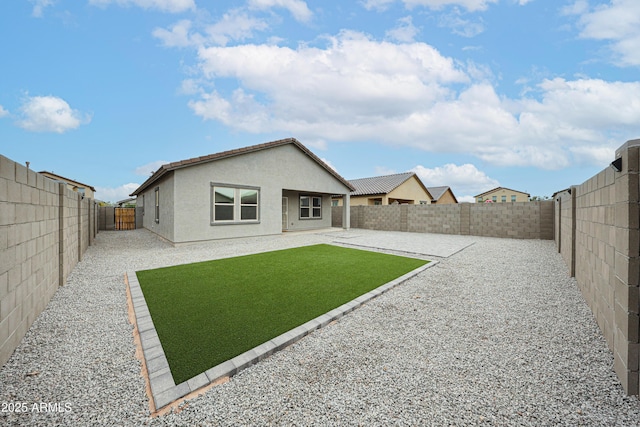 5721 W Coplen Farms Rd, Laveen, AZ 85339 - rear view of house featuring stucco siding and a patio area