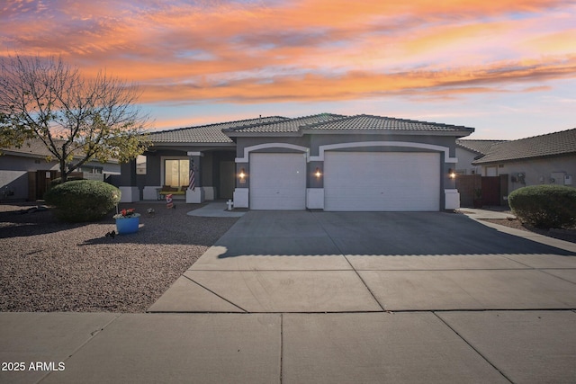 prairie-style house featuring a garage