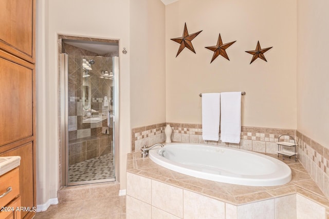 bathroom with vanity, tile patterned flooring, and independent shower and bath