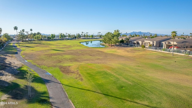 surrounding community featuring a yard and a water and mountain view