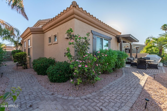 view of side of home featuring a patio