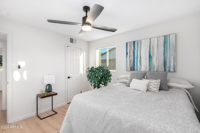 bedroom featuring light hardwood / wood-style floors and ceiling fan