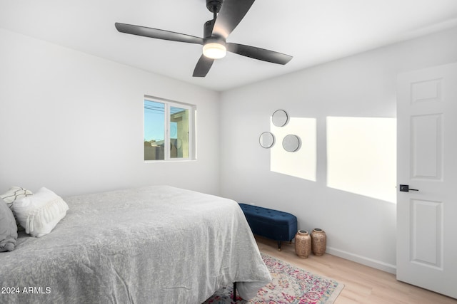 bedroom with ceiling fan and light wood-type flooring