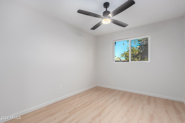 empty room featuring light hardwood / wood-style flooring and ceiling fan