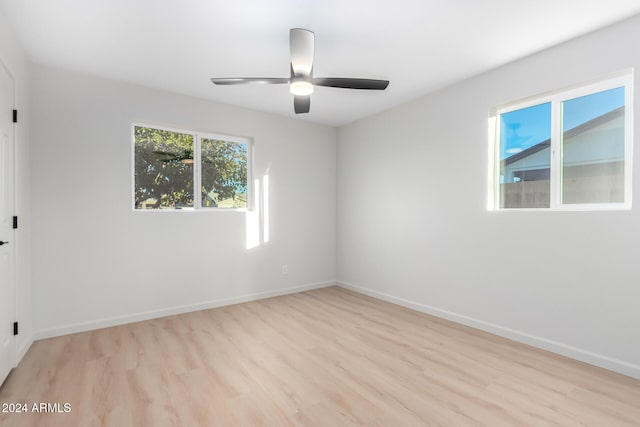 unfurnished room featuring ceiling fan and light hardwood / wood-style flooring