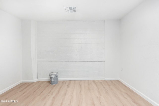 empty room with light hardwood / wood-style flooring