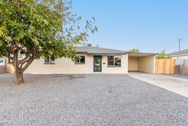 view of front of house with a carport