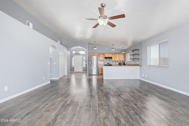 unfurnished living room featuring ceiling fan, lofted ceiling, and hardwood / wood-style floors