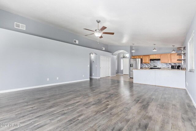 kitchen featuring decorative light fixtures, light tile patterned flooring, tasteful backsplash, stainless steel appliances, and sink