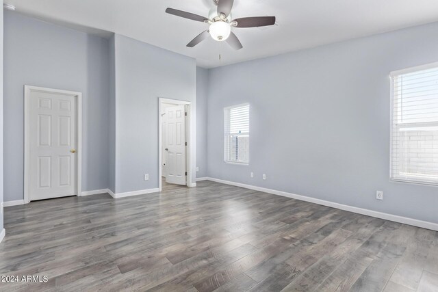 bathroom with ceiling fan, hardwood / wood-style floors, and double vanity