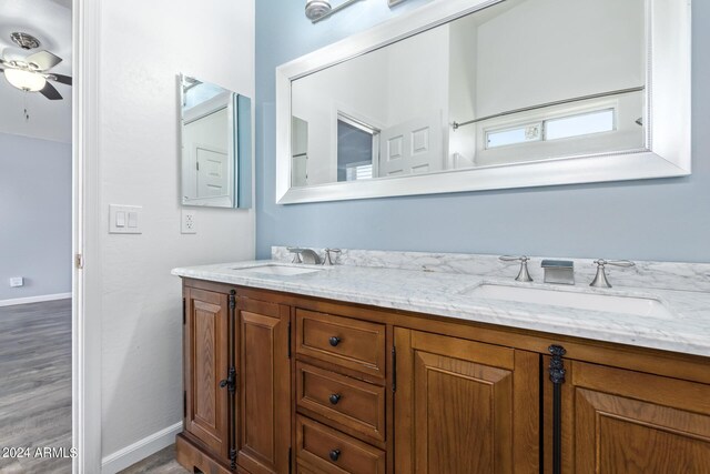 unfurnished room with ceiling fan, hardwood / wood-style flooring, and vaulted ceiling