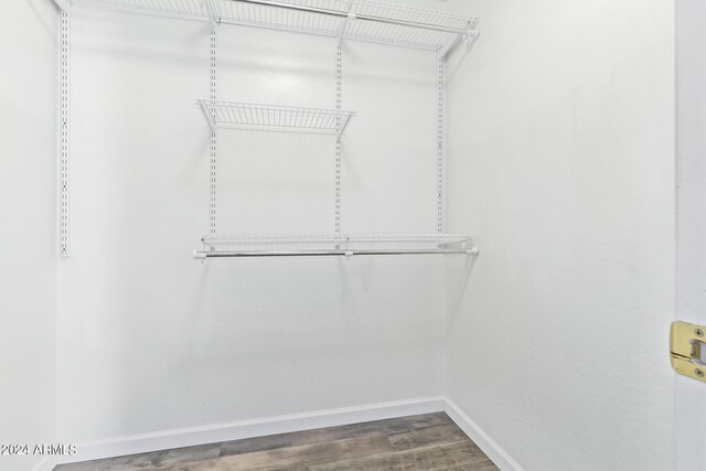 unfurnished bedroom with a closet, hardwood / wood-style floors, and ceiling fan