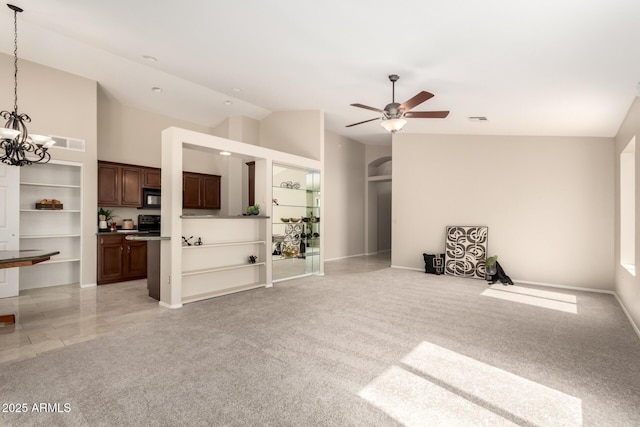 unfurnished living room with ceiling fan, vaulted ceiling, a chandelier, light carpet, and baseboards