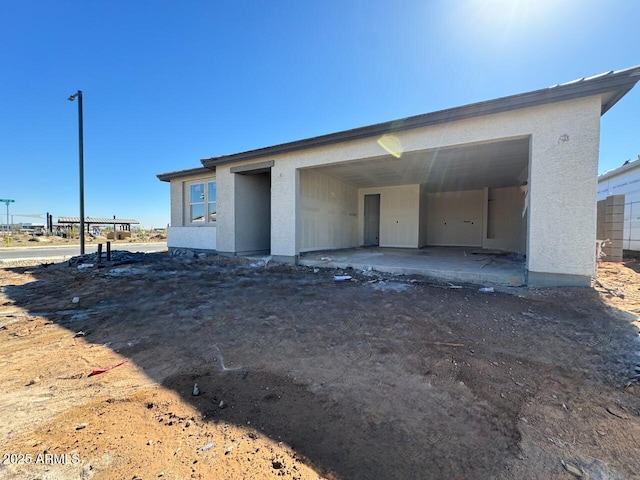 view of front of home featuring stucco siding