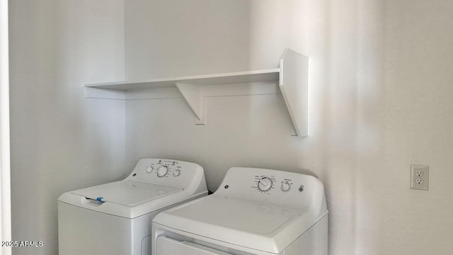 laundry area with laundry area and washing machine and clothes dryer