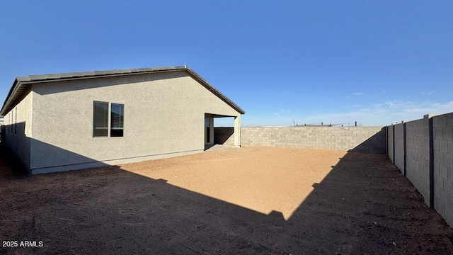 exterior space with a fenced backyard