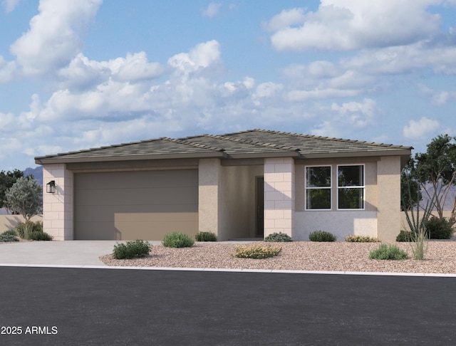 prairie-style house featuring concrete driveway, an attached garage, and stucco siding