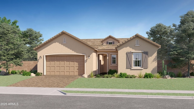 mediterranean / spanish-style house with fence, an attached garage, stucco siding, a front lawn, and decorative driveway