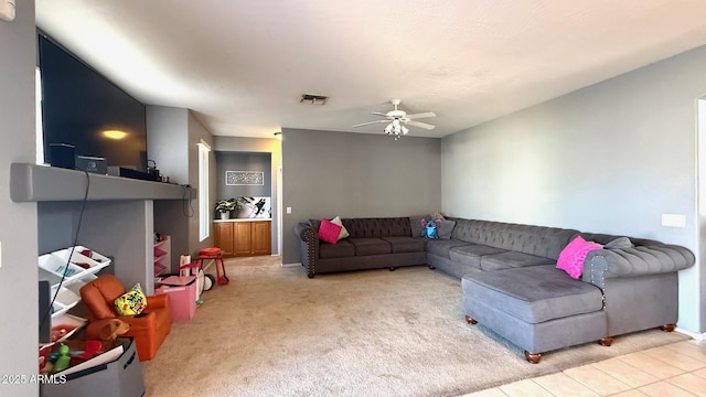 living room featuring ceiling fan and light colored carpet