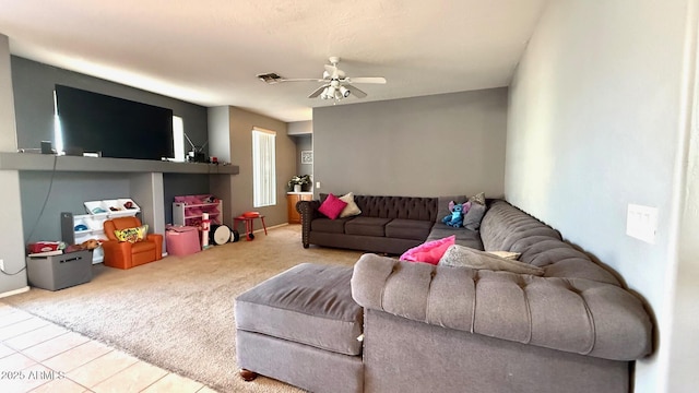 living room featuring carpet floors and ceiling fan