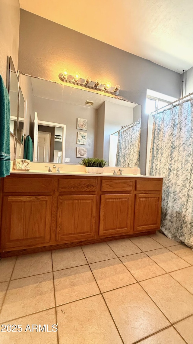 bathroom featuring vanity and tile patterned floors