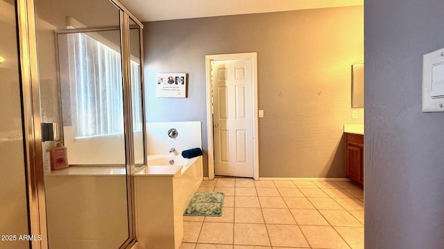 bathroom featuring vanity, tile patterned floors, and plus walk in shower