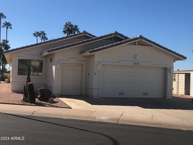 single story home featuring a garage