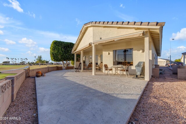 rear view of house featuring a patio