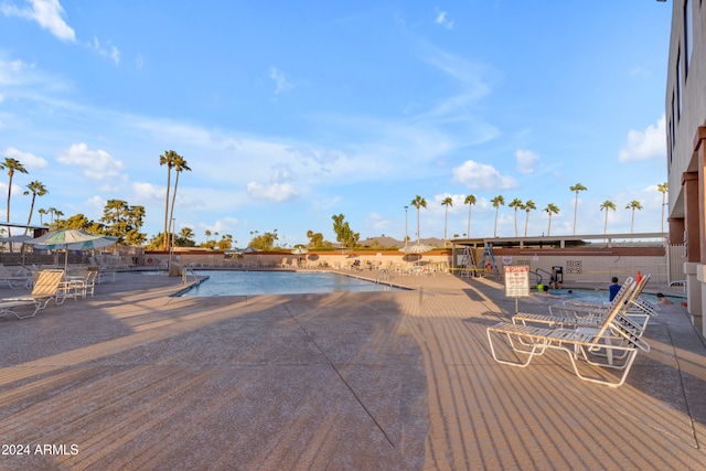 view of swimming pool with a patio area