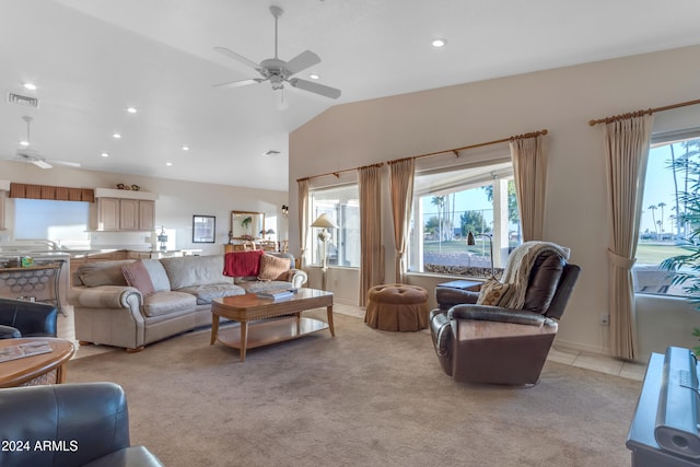 carpeted living room featuring ceiling fan and lofted ceiling