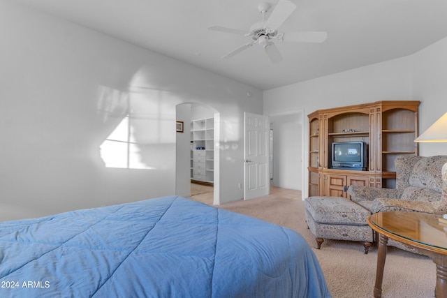 bedroom with light carpet and ceiling fan