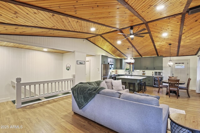 living room featuring wood ceiling, light wood-style floors, ceiling fan, and beverage cooler