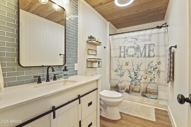 full bath featuring wooden ceiling, tasteful backsplash, wood finished floors, toilet, and vanity