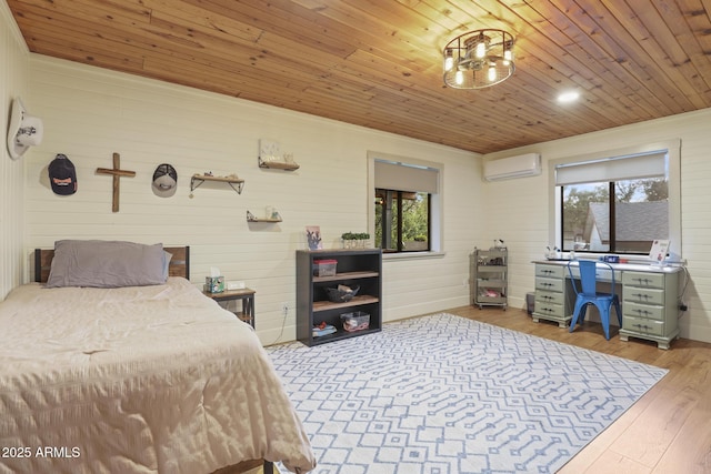 bedroom with a wall mounted air conditioner, multiple windows, wood finished floors, wooden ceiling, and wood walls
