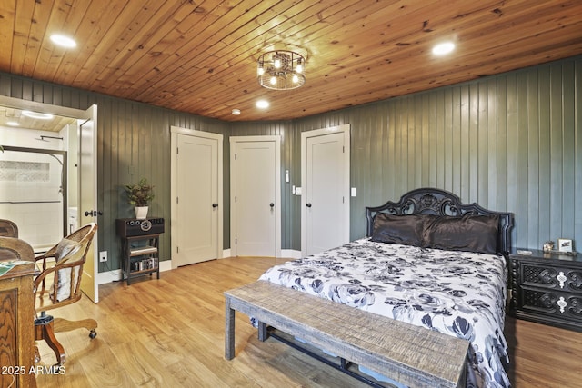 bedroom with recessed lighting, wood walls, wood finished floors, and wooden ceiling