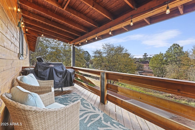 wooden terrace with area for grilling