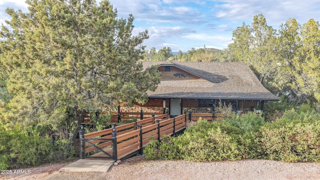 view of front of home with roof with shingles
