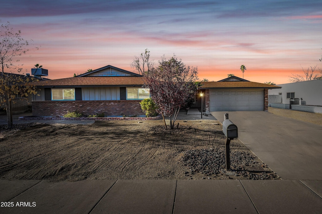 ranch-style home featuring a garage